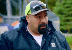 Juan Ibarra from Gold Rush wearing a work jacket and cap at a mining site in 2025 – American mechanic and TV personality