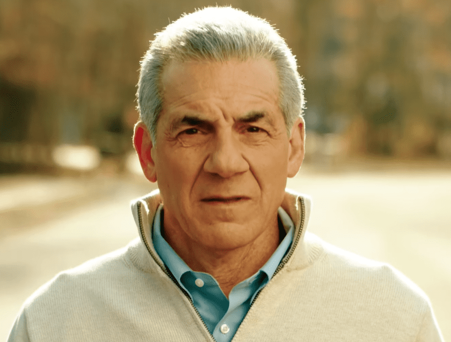 ack Ciattarelli outdoors wearing a beige sweater over a blue shirt, showing his approachable personality — Jack Ciattarelli net worth and public image