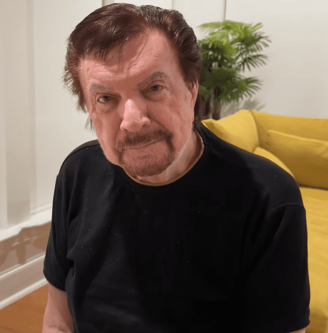 Mike Murdock sitting indoors wearing a black shirt, 2025 portrait image used for biography and net worth article.